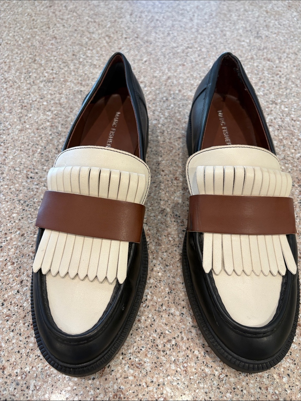 Woman’s Marc Fisher Black and Cream Kiltie Loafers with Brown Strap